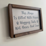 Made in the UK by Giggle Gift Co
Rectangular L33.5cm Framed Plaque with&nbsp;Grey vinyl;
Quote in Dark Grey text - "This house is filled with kisses, wagging tails wet noses and love"