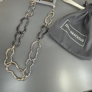 Eliza Gracious quality affordable design led branded costume jewellery

Short mis-shaped chain link Necklace with beaten effect&nbsp;

Gold mix colour