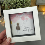 Pebble Art by La De Da Living&nbsp;

Award winning keepsake gifts - Handmade in the Cotswolds&nbsp;

Mini Framed Pebble Art - White block square frame 12.5cm
'So very proud of you'