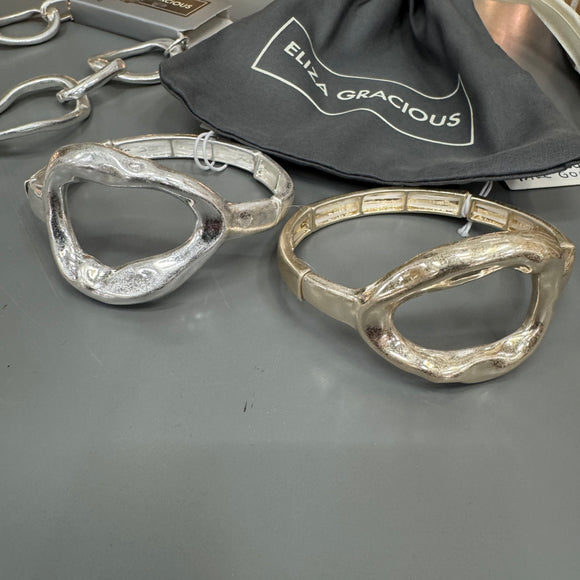Eliza Gracious quality - affordable design led branded costume jewellery.

Open Oval decoration expanding bangle with brushed finish 

Available in Burnished Pale Gold & Matt Silver