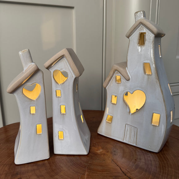 Stone Glazed Ceramic Light up Houses with heart detail
LR44 Battery operated that can be replaced 

Available in 2 sizes/shapes: Small split houses H17cm & Large joint H21.5cm