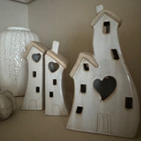 Stone Glazed Ceramic Light up Houses with heart detail
LR44 Battery operated that can be replaced&nbsp;

Available in 2 sizes/shapes: Small split houses H17cm &amp; Large joint H21.5cm