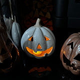 Beige glazed Ceramic spooky Pumpkin T-light holder with a rough stone stem H15cm