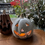 Beige glazed Ceramic spooky Pumpkin T-light holder with a rough stone stem H15cm