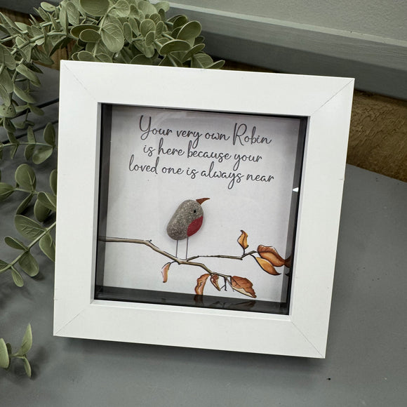 Mini Framed Pebble Art -White block square frame 12.5cm
Image - Pebble Robin sat on a leafy branch
Quote - 'Your very own Robin is here because your loved one is always near'
