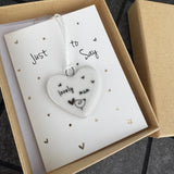 Belly Button Designs - Unique British Brand

Signature Collection - Gifted with love
Mini white Porcelain Heart decoration on card 'Just to say' &amp; Gift boxed 10cm
Quote - Lovely mum