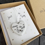 Belly Button Designs - Unique British Brand

Signature Collection - Gifted with love
Mini white Porcelain Heart decoration on card 'Just to say' &amp; Gift boxed 10cm
Quote - Welcome to the world