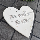 Belly Button Designs - Unique British Brand

Signature Collection decorated with bird motif - Gifted with love

White Ceramic glazed 11cm Heart shaped Coaster;
Cute bunting illustration with the bird motif sat on top &amp; delicate gold foil star &amp; hearts accent with the quote 'Tea time is me Time'