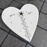 Belly Button Designs - Unique British Brand

Signature Collection decorated with bird motif - Gifted with love

White Ceramic glazed 11cm Heart shaped Coaster;
Charming stacked bird motif &amp; delicate gold foil star at the top with the quote 'you're a star!' '
