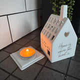 Radar - T-light Light House&nbsp;
White Porcelain with the base for the t-light and house with lots of windows &amp; doors to light it up beautifully when lit.&nbsp;
Quote in gold text - Home is where the heart is