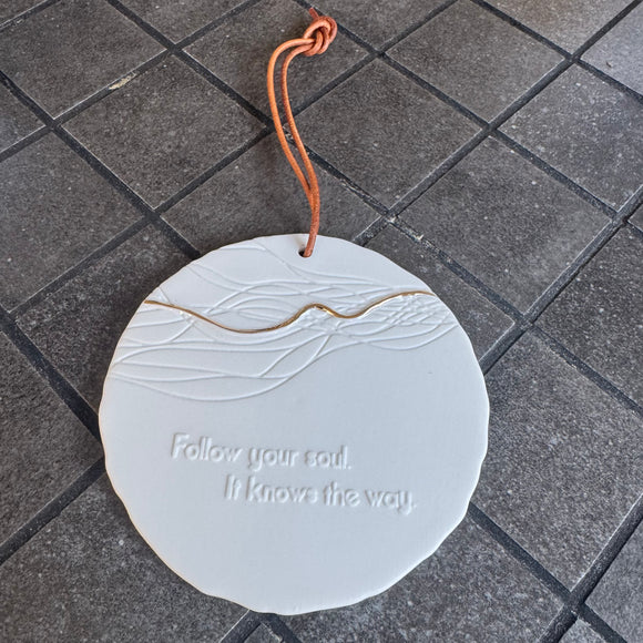Radar Poetry - White Porcelain 10cm Round hanging Medallion  
Quote engraved in the Tile - 'Follow your soul.  It knows the way.' with a gold filigree detail