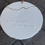 Radar Poetry - White Porcelain 10cm Round hanging Medallion&nbsp;&nbsp;
Quote engraved in the Tile - 'Follow your soul.&nbsp; It knows the way.' with a gold filigree detail