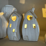 Stone Glazed Ceramic Light up Houses with heart detail
LR44 Battery operated that can be replaced
Bulbous Wide split Houses H14cm&nbsp;