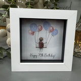 Pebble Art by La De Da Living&nbsp;
Award winning keepsake gifts - Handmade in the Cotswolds&nbsp;
Mini Framed Pebble Art - White block square frame 12.5cm
'Happy 70th Birthday' with cluster of pink &amp; blue balloons..