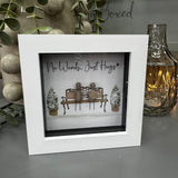 Pebble Art by La De Da Living&nbsp;

Award winning keepsake gifts - Handmade in the Cotswolds&nbsp;

Mini Glitter Framed Pebble Art - White block square frame 12.5cm
Image - 2 Pebble people sat on a bench together with two planted bushes covered in white glitter..
Quote - 'No Words... Just Hugs'