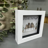 Pebble Art by La De Da Living&nbsp;

Award winning keepsake gifts - Handmade in the Cotswolds&nbsp;

Mini Glitter Framed Pebble Art - White block square frame 12.5cm
Image - 2 Pebble people sat on a bench together with two planted bushes covered in white glitter..
Quote - 'No Words... Just Hugs'