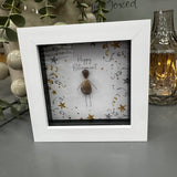 Pebble Art by La De Da Living&nbsp;

Award winning keepsake gifts - Handmade in the Cotswolds&nbsp;

Mini Framed Pebble Art - White block square frame 12.5cm
'Happy Retirement' Pebble person surrounded by silver &amp; gold confetti &amp; stars celebrating..