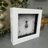 Pebble Art by La De Da Living&nbsp;

Award winning keepsake gifts - Handmade in the Cotswolds&nbsp;

Mini Framed Pebble Art - White block square frame 12.5cm
'Happy Retirement' Pebble person surrounded by silver &amp; gold confetti &amp; stars celebrating..