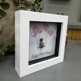 Pebble Art by La De Da Living&nbsp;

Award winning keepsake gifts - Handmade in the Cotswolds&nbsp;
Mini Framed Pebble Art - White block square frame 12.5cm
'Happy 60th Birthday' with a cluster of balloons..