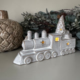 Neutral glazed Ceramic LED detailed steam Train with textured finish L19cm; xmas tree and a pile of gifts on top, instead of a pile of coal
