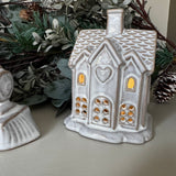 Neutral glazed Ceramic LED detailed small House H11cm and lots of windows to light up when switched on..
