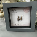 Pebble Art by La De Da Living&nbsp;

Award winning keepsake gifts - Handmade in the Cotswolds&nbsp;

Mini Framed Pebble Art - Grey block square frame 12.5cm
'Here's to forever, Happy Engagement'
