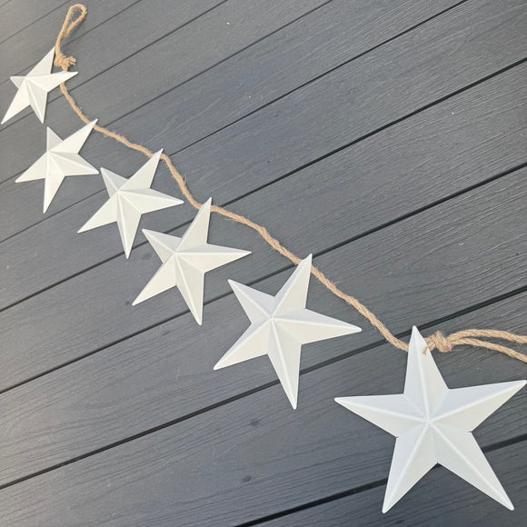 6No. White Metal Stars attached to a rope Garland L128cm with loops either end.
