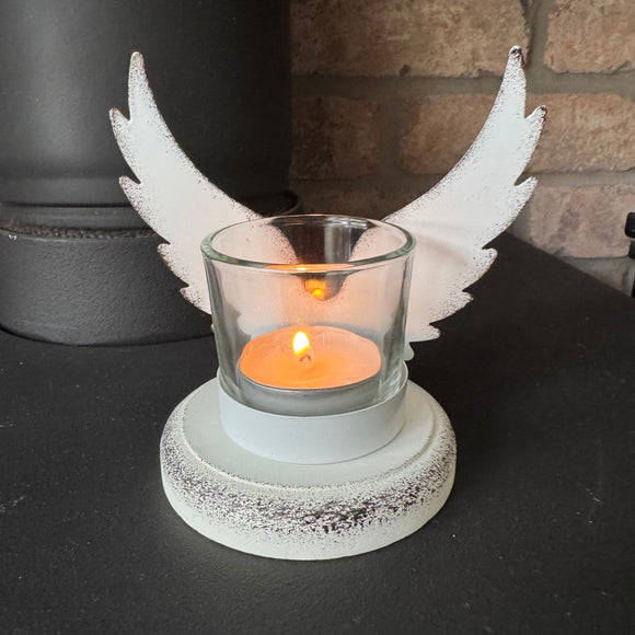 White distressed metal Angel Wings with a glass holder for t-light 