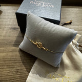 Gold plated love knot bolo bracelet