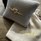 Gold plated love knot bolo bracelet