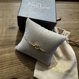 Gold plated love knot bolo bracelet