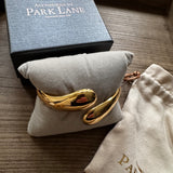 Gold Plated teardrop open cuff hinged bangle bracelet supplied with the cloth bag by Accessories by Park Lane