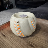 Beige round ceramic Pumpkin wax melt burner with cut out leaf details 9x14cm&nbsp;