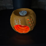 Orange Ceramic Wax Burner with cut out leaf design