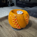 Orange Ceramic Wax Burner with cut out leaf design