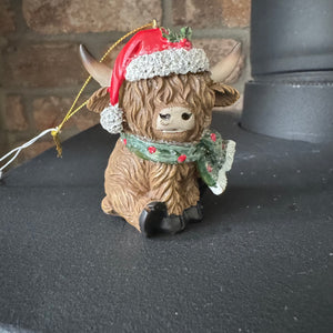 Hanging Festive 7.5cm Highland Cow Decoration wearing a red santa hat &amp; green spotty scarf