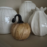 Wooden pumpkin with twisted metal top