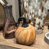 Wooden pumpkin with twisted metal top