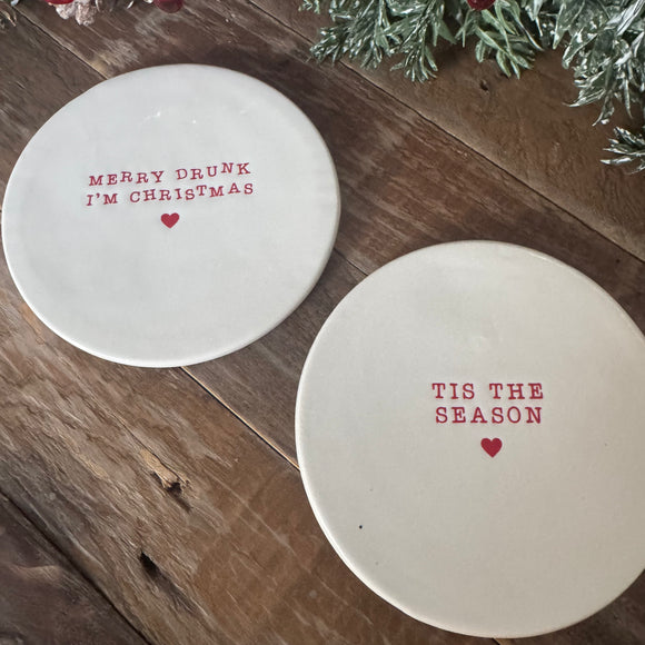Christmas White glazed ceramic Coasters 10cm 
Available in 2 quotes in red text; 'Tis the Season' & 'Merry Drunk I'm Christmas'