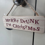 Small wooden hanging sign 15cm with distorted lettering
Quote - 'Merry Drunk I'm Christmas'&nbsp;