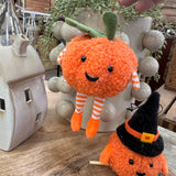 Fabric pumpkin decoration with dangling legs