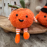 Fabric pumpkin decoration with dangling legs