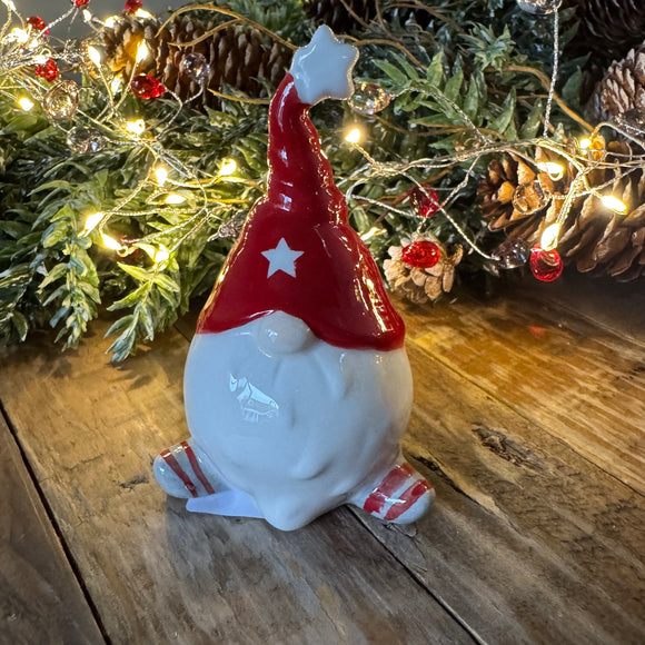 Small Ceramic glazed Gonk wearing a twisted tall  Red hat 10cm