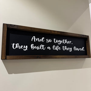 Made in the UK by Giggle Gift co.
Rectangular L64cm Framed Plaque with Black vinyl;
Quote in white text - And so together, they built a life they loved