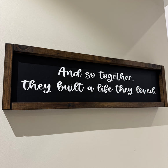 Made in the UK by Giggle Gift co.
Rectangular L64cm Framed Plaque with Black vinyl;
Quote in white text - And so together, they built a life they loved