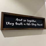 Made in the UK by Giggle Gift co.
Rectangular L64cm Framed Plaque with Black vinyl;
Quote in white text - And so together, they built a life they loved
