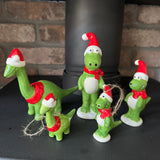 Christmas Ceramic Green Dinosaur Ornaments wearing red santa hats &amp; scarves with a big smile&nbsp;
Available in Diplodocus &amp; T-Rex in 2 sizes