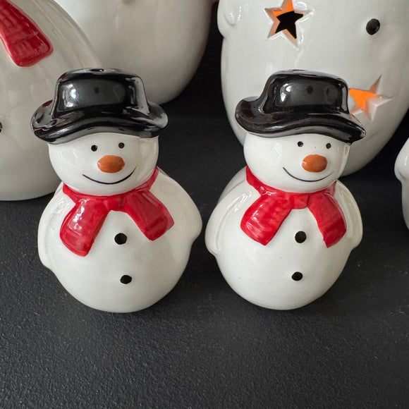 Christmas Ceramic Classic White Snowman collection
Wearing a Red scarf, black hat and smiling face body 
Fun Salt & Pepper Pots 7.5cm