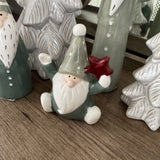 Small Sitting Green Santa holding a star 10cm&nbsp;