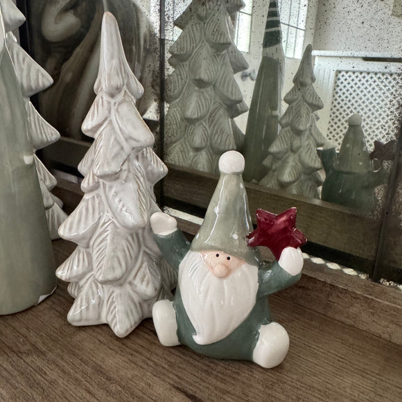 Small Sitting Green Santa holding a star 10cm 